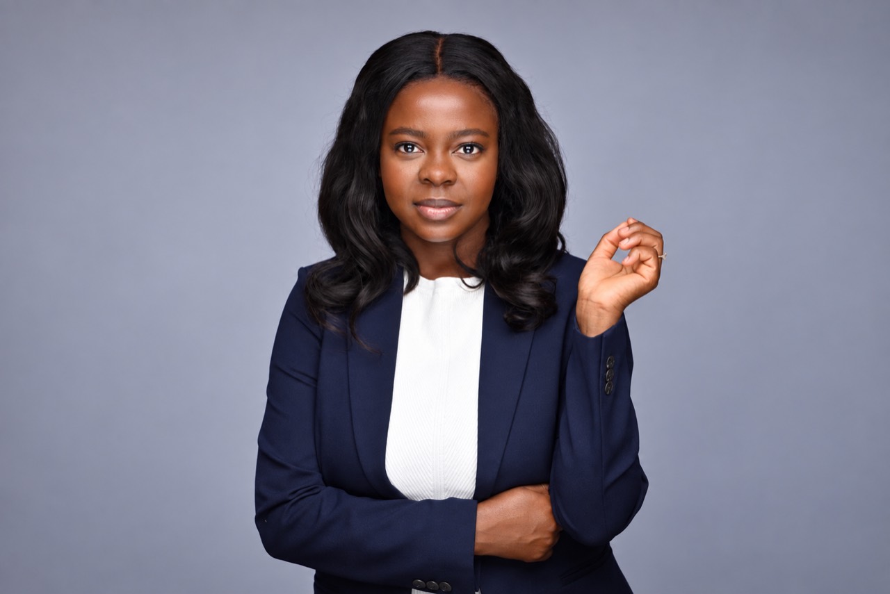 Silvia Owusu-Agyeman in a navy blazer and white blouse
